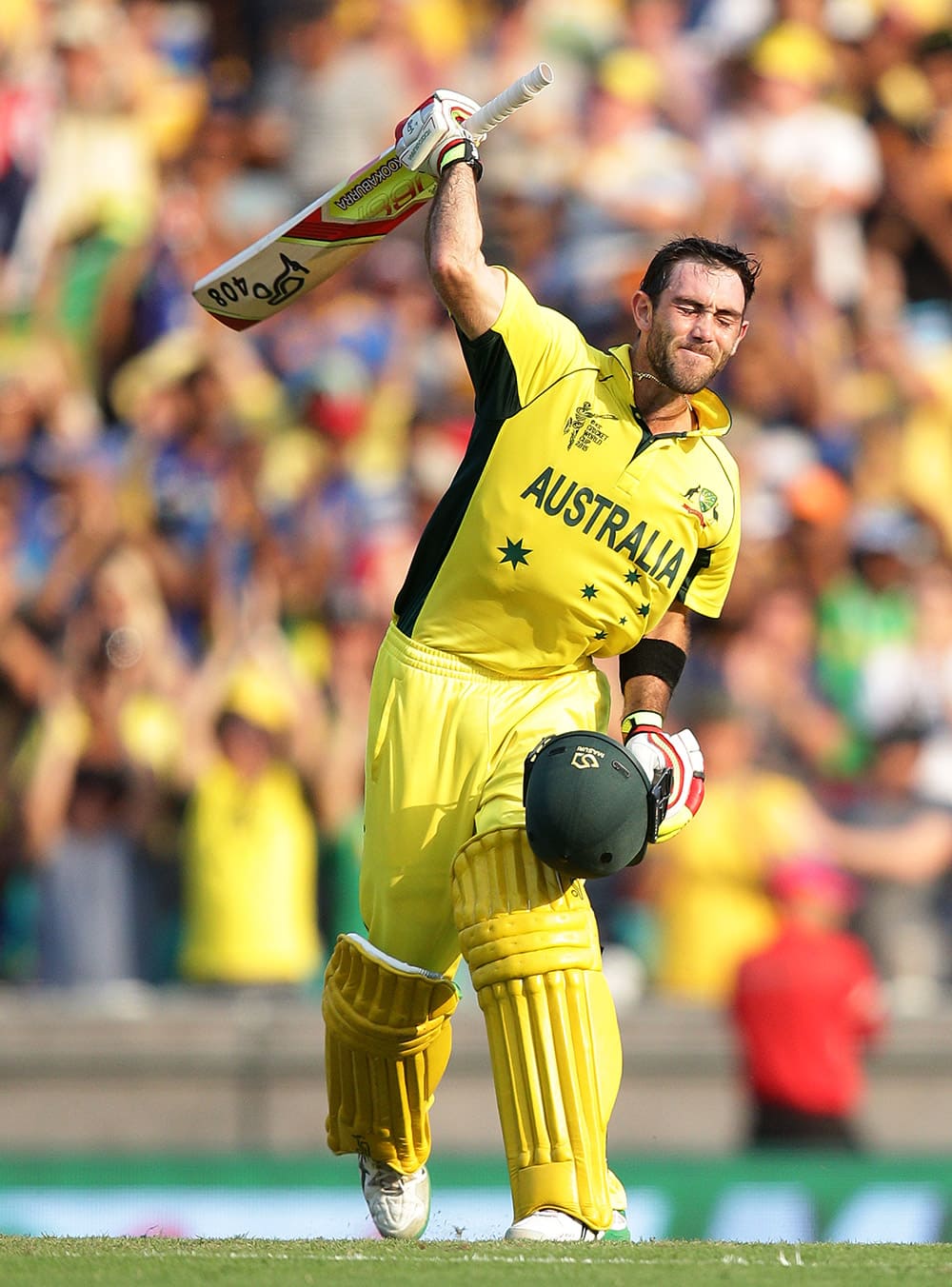 Australia's Glenn Maxwell celebrates after scoring a century while batting against Sri Lanka during their Cricket World Cup Pool A match in Sydney, Australia.