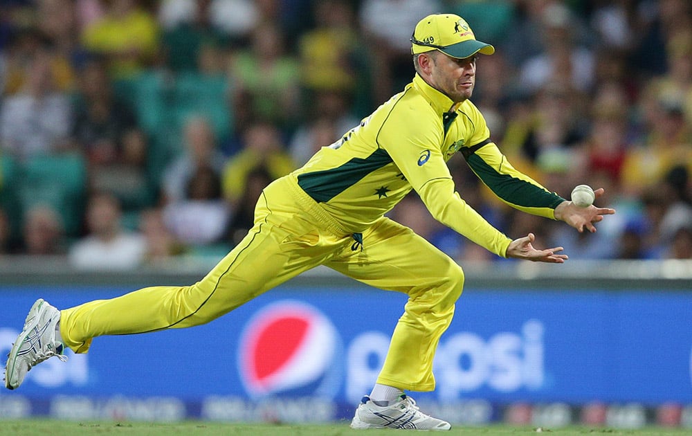 Australia’s captain Michael Clarke attempts a catch that he dropped during their Cricket World Cup Pool A match against Sri Lanka in Sydney, Australia.