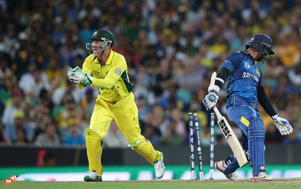 Australia's Brad Haddin, attempts unsuccessfully to dismiss Sri Lanka’s Kumar Sangakkara, right, during their Cricket World Cup Pool A match in Sydney, Australia.