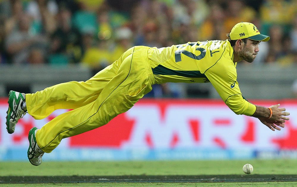 Australia’s Glenn Maxwell attempts an unsuccessful catch during their Cricket World Cup Pool A match against Sri Lanka in Sydney, Australia.