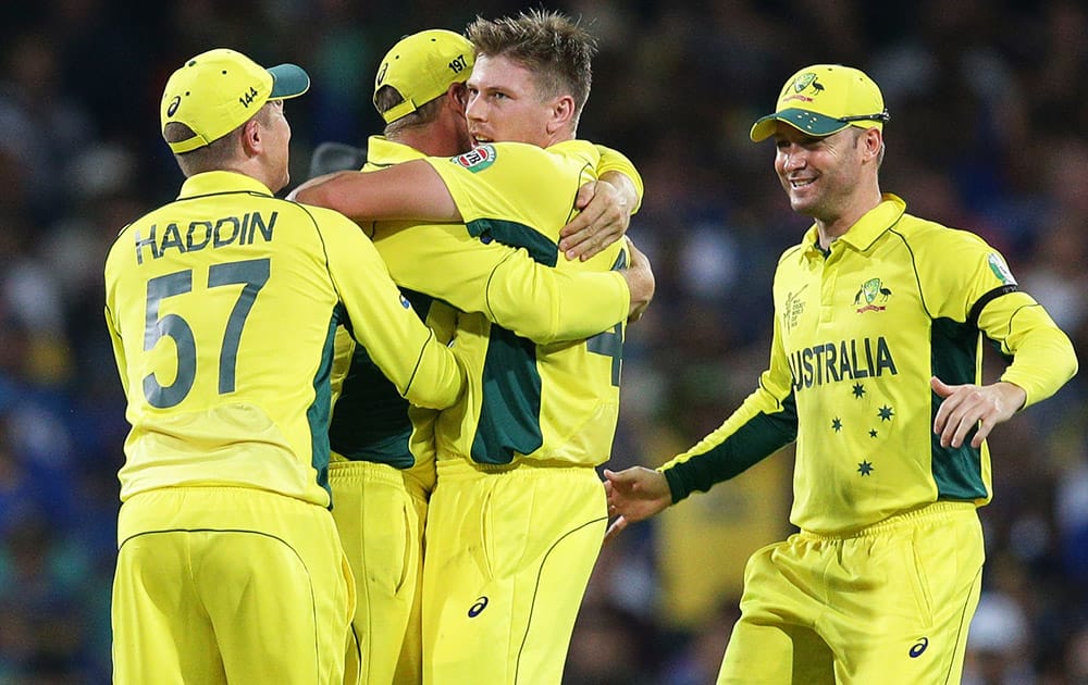 Australians celebrate the dismissal of Sri Lanka’s Kumar Sangakkara, during their Cricket World Cup Pool A match in Sydney, Australia.