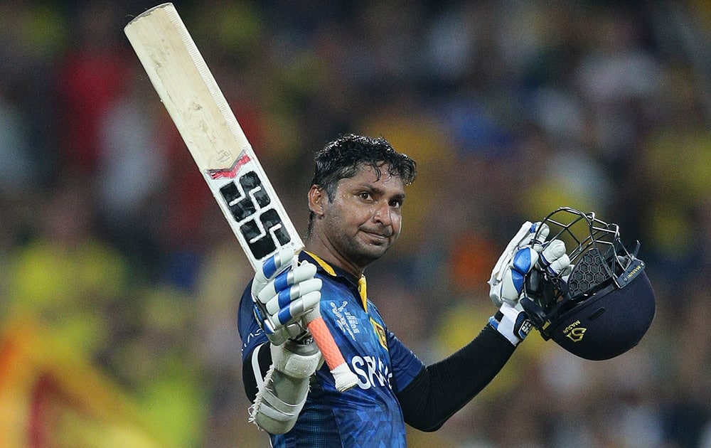 Sri Lanka’s Kumar Sangakkara, celebrates his hundred runs during their Cricket World Cup Pool A match against Australia in Sydney, Australia.