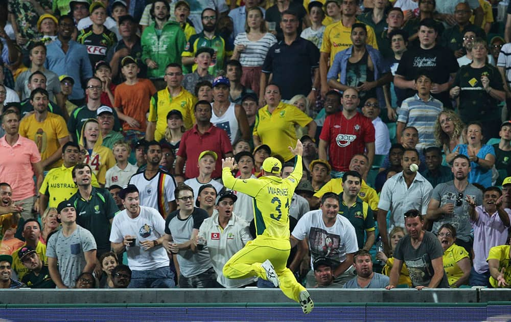 Australia’s David Warner tries to catch a sixer from Sri Lanka’s Angelo Mathews during their Cricket World Cup Pool A match in Sydney, Australia.