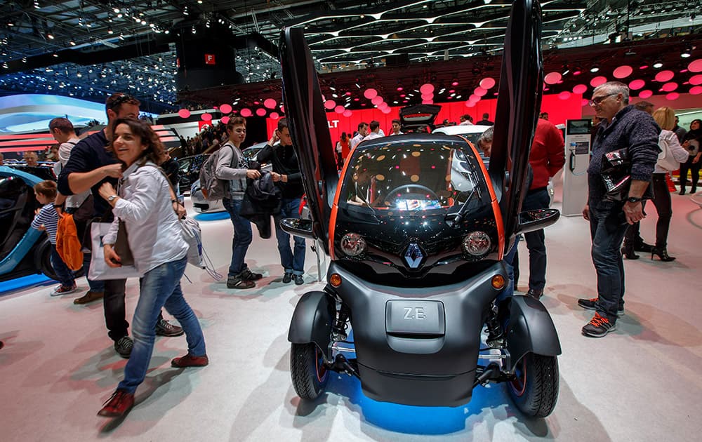 visitors gather at the Renault booth during the first weekend open for the public at the Geneva International Motor Show, in Geneva, Switzerland.