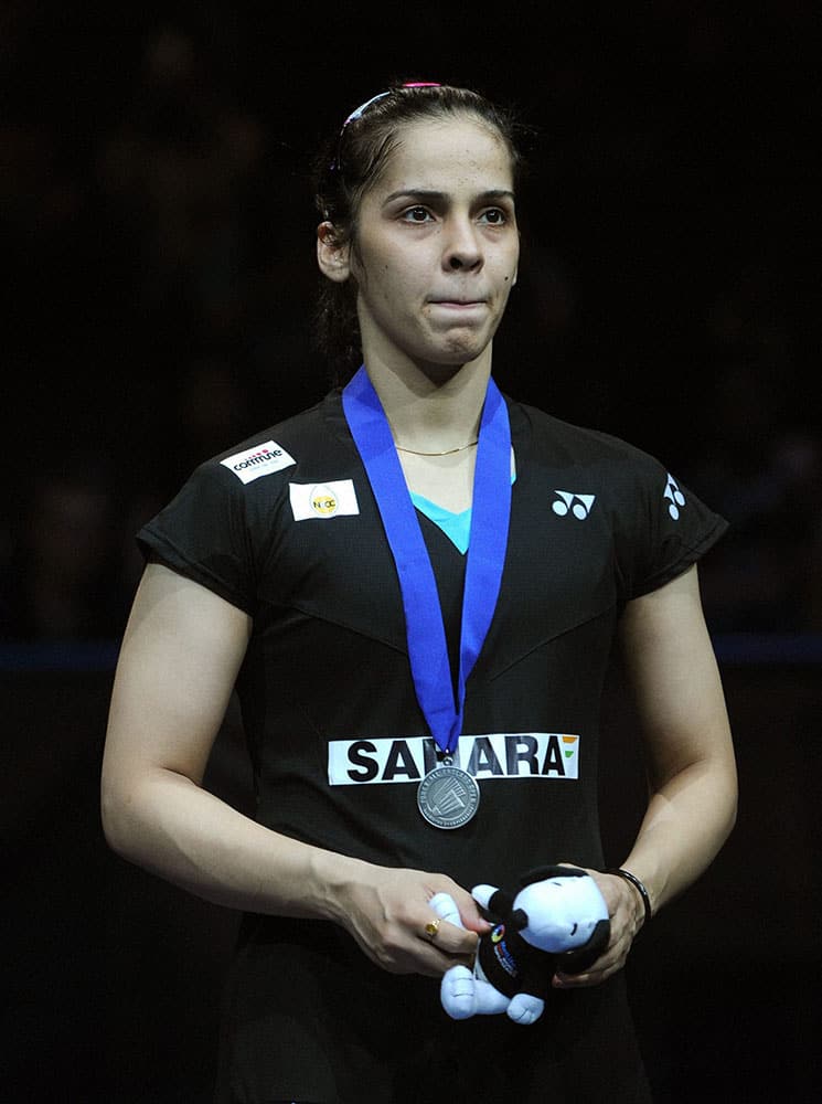 India’s Saina Nehwal stands on the podium as runner up, after being beaten by Spain’s Carolina Marin during the Women’s Singles final, at the All England Badminton Championships in Birmingham.