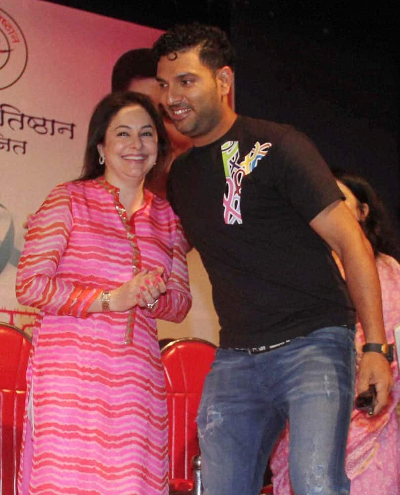 Cricketer Yuvraj Singh and Anjali Tendulkar attend a cancer awareness program specially for women on the occasion of International womens day in Mumbai.