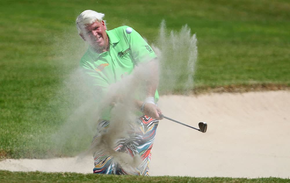 John Daly of the U.S. strikes the ball from the 10th hole bunker during the final round of the Puerto Rico Open PGA golf tournament in Rio Grande, Puerto Rico.