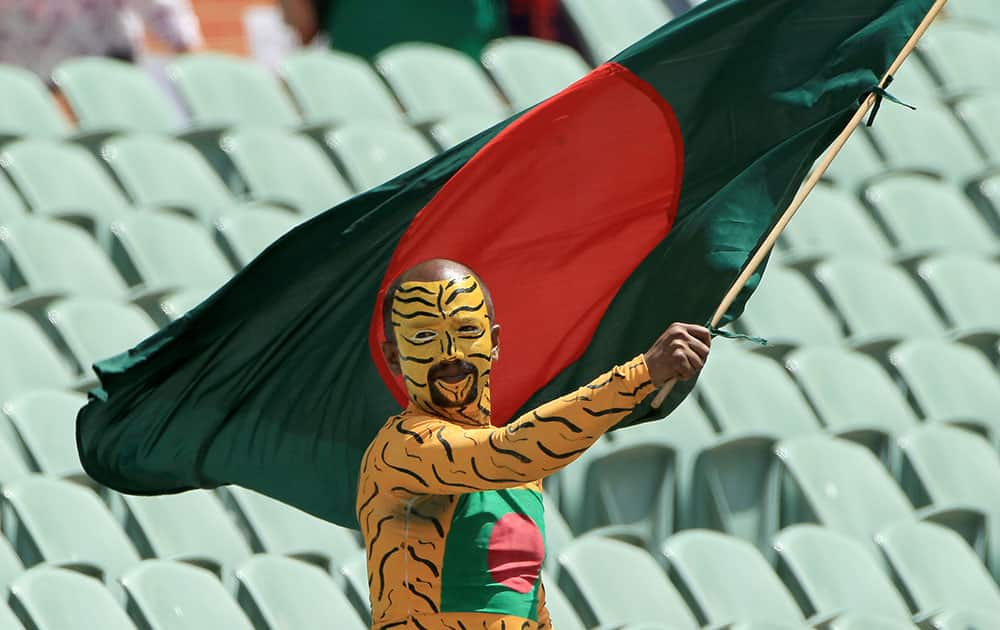 A Bangladesh supporter waves his national flag ahead of his team's Cricket World Cup Pool A match against England in Adelaide, Australia.