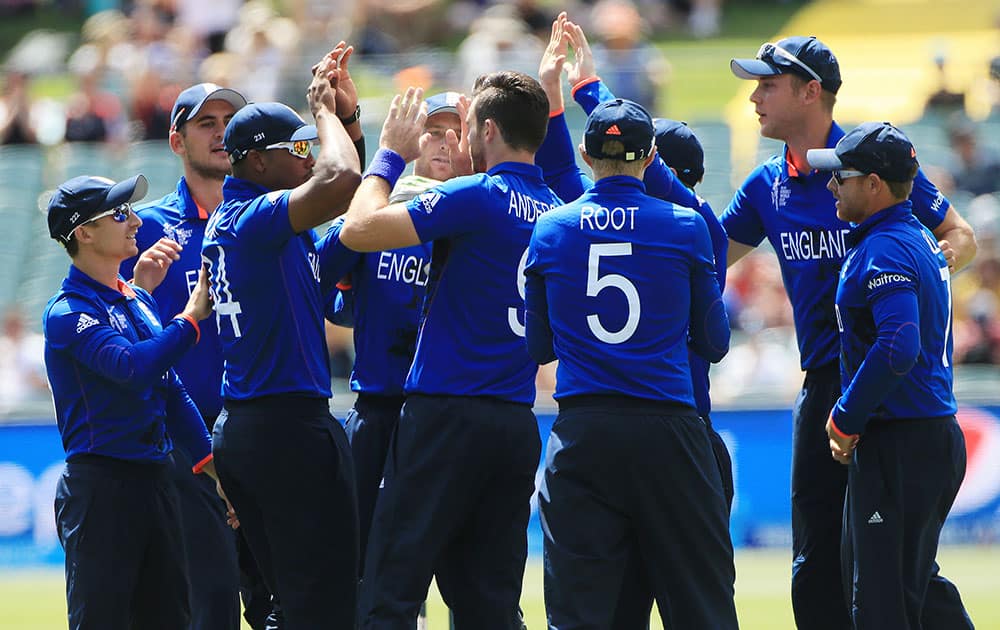 England players celebrate the dismissal of Bangladesh batsman Imrul Kayes during their Cricket World Cup Pool A match in Adelaide, Australia.