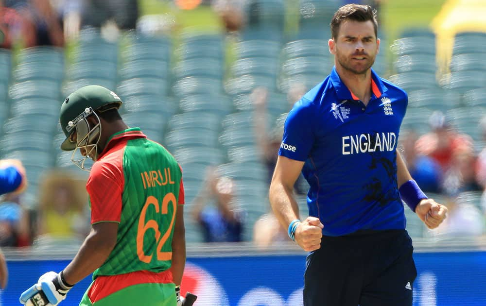 Bangladesh batsman Imrul Kayes walks from the field after he was dismissed by England's James Anderson, right, during their Cricket World Cup Pool A match in Adelaide, Australia.