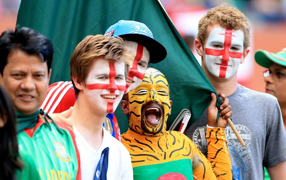 England and Bangladesh supporters pose for a photo during the Cricket World Cup Pool A match in Adelaide, Australia.