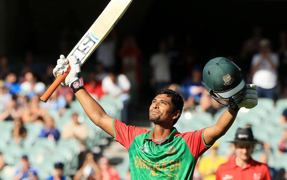 Bangladesh batsman Mahmudullah celebrates after scoring a century while batting against England during their Cricket World Cup Pool A match in Adelaide, Australia.