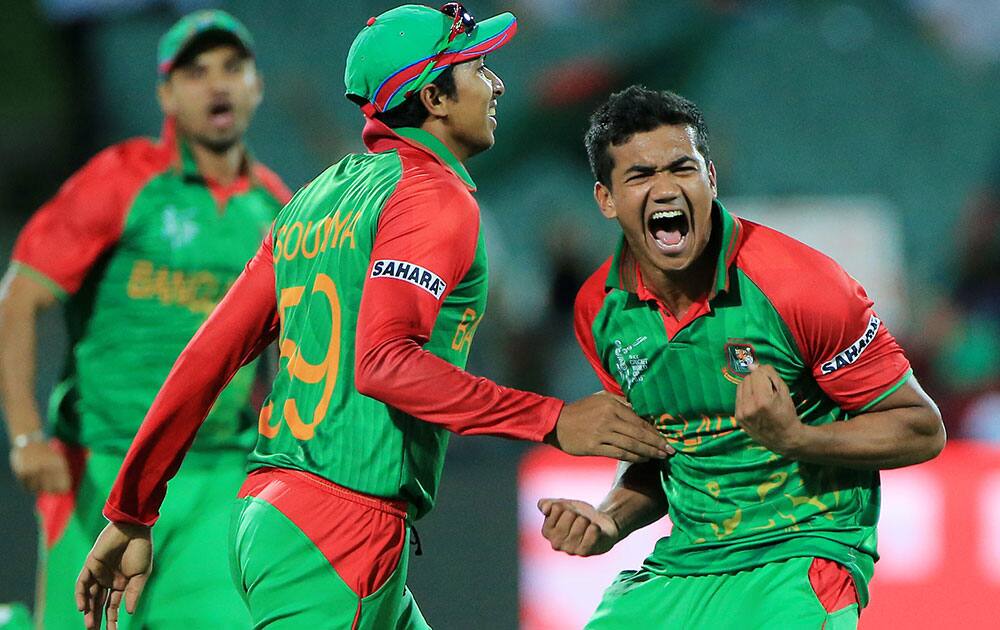 Bangladesh bowler Taskin Ahmed, right, celebrates with teammate Sarkar Soumya after dismissing England batsman James Taylor during their Cricket World Cup Pool A match in Adelaide, Australia.