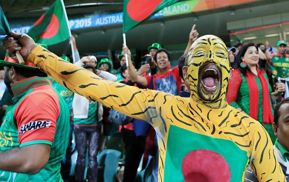 Bangladesh supporters celebrate after their team's 15 run win over England in their Cricket World Cup Pool A match in Adelaide, Australia.