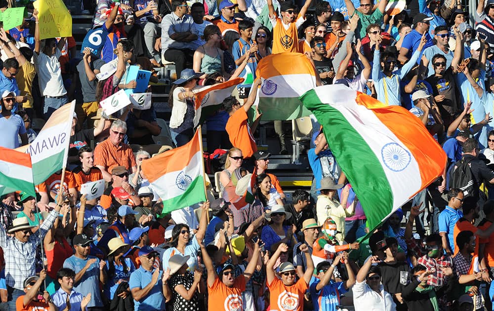 Indian fans cheer their team on during their Cricket World Cup Pool B match against Ireland in Hamilton, New Zealand.