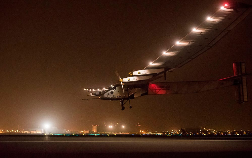 a Swiss solar-powered plane lands in Muscat, Oman, after it took off from Abu Dhabi early Monday, marking the start of the first attempt to fly around the world without a drop of fuel. Solar Impulse founder Andre Borschberg was at the controls of the single-seater when it took off from the Al Bateen Executive Airport. 