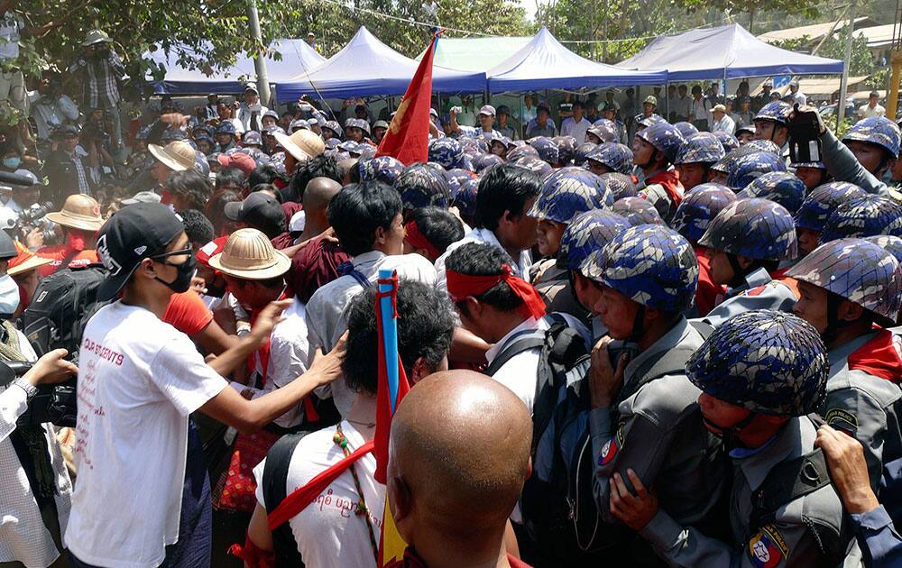 Student protesters who have been staging a sit-in since March 3, try to push through police blockade in Letpadan, 140 kilometers (90 miles) north of the country's main city Yangon, Myanmar.