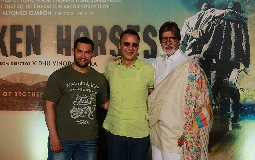 Amitabh Bachchan and Aamir Khan pose with film maker Vidhu Vinod Chopra during the launch of the trailer of Chopra’s maiden Hollywood film ‘Broken Horses’ in Mumbai.