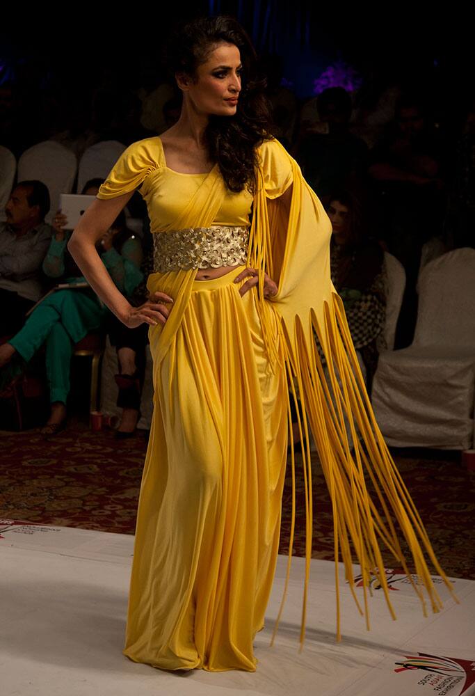 A model presents creations by Indian designer Jattinn Kochhar at South Asian Fashion Exhibition 2015 , in Karachi, Pakistan. 