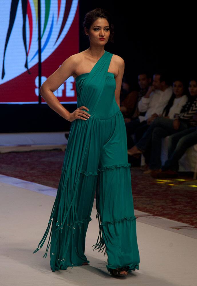 A model presents creations by Indian designer Jattinn Kochhar at South Asian Fashion Exhibition 2015 , in Karachi, Pakistan. 