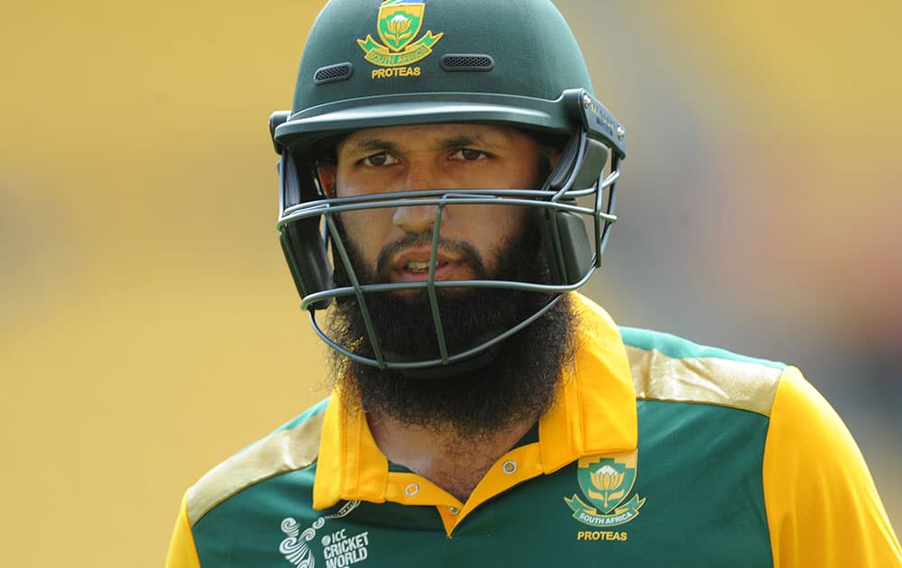 South African batsman Hashim Amla walks from the field after he was dismissed during their Cricket World Cup Pool B match against the United Arab Emirates in Wellington, New Zealand.