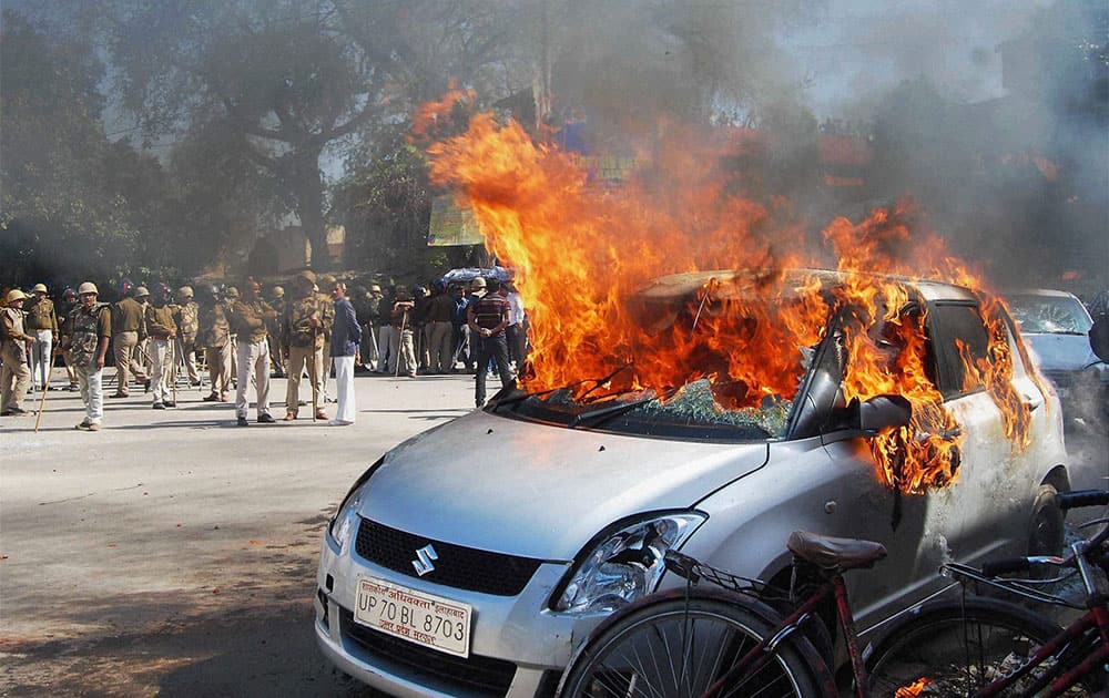 Angry advocates set ablaze vehicles after a clash in the court campus in Allahabad.