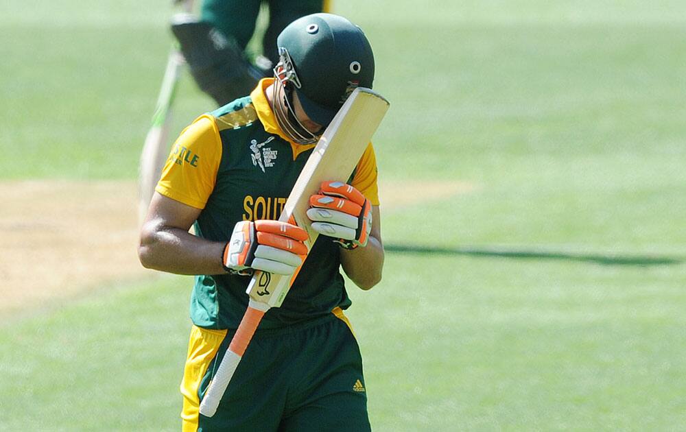 South African batsman Rilee Rossouw walks from the field after he was dismissed for 43 runs during their Cricket World Cup Pool B match against the United Arab Emirates in Wellington, New Zealand.