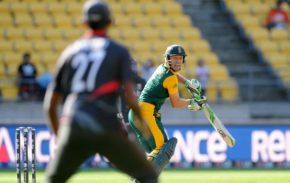 South African batsman A.B de Villiers watches as the ball flies to United Arab Emirates fielder Amjad Javed to be out caught for 99 runs during their Cricket World Cup Pool B match in Wellington, New Zealand.