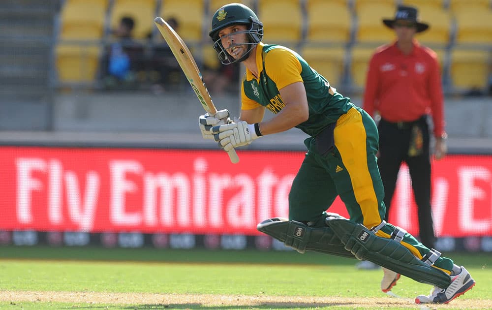 South Africa's Farhaan Behardien hits the ball to the boundary while batting against the United Arab Emirates during their Cricket World Cup Pool B match in Wellington, New Zealand.