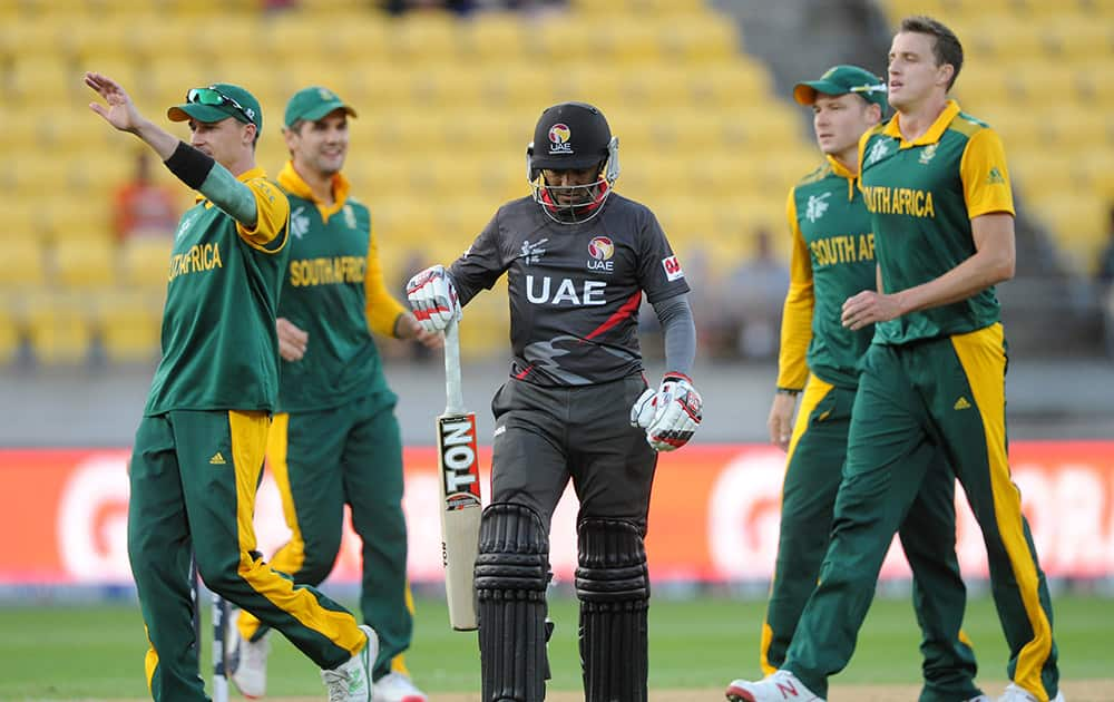 South African bowler Morne Morkel, celebrates with teammate's taking the wicket of United Arab Emirates Khurram Khan, centre, during their Cricket World Cup Pool B match in Wellington, New Zealand.