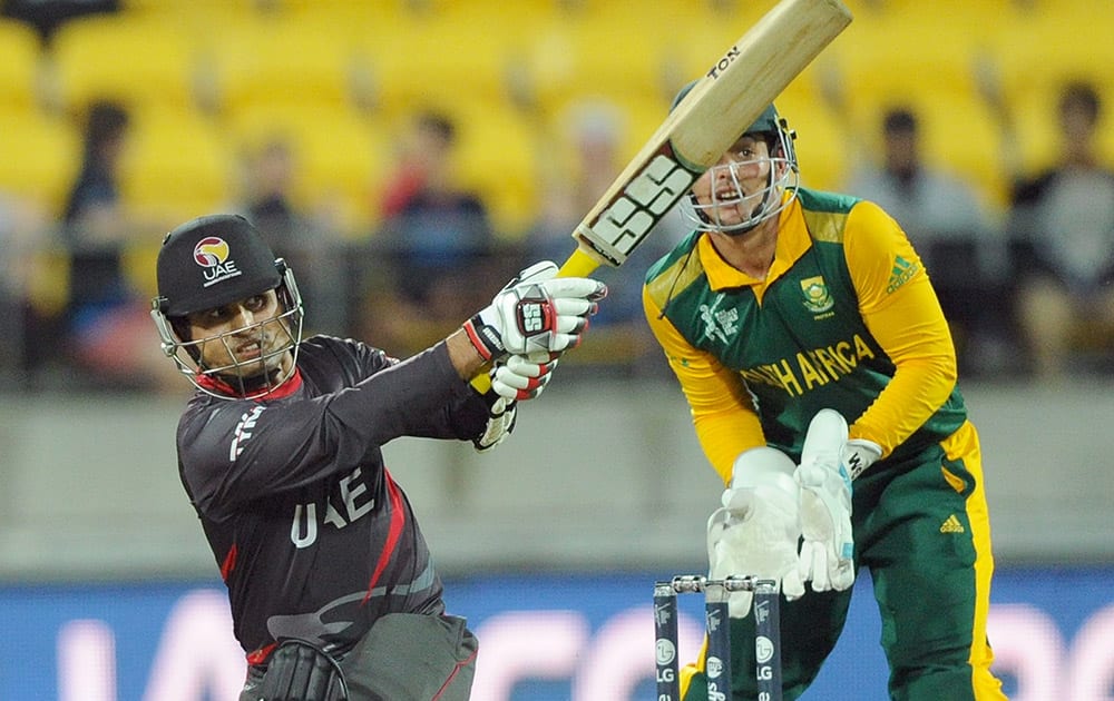 United Arab Emirates batsman Shaiman Anwar plays a shot as South African wicketkeeper Quinton De Kock watches during their Cricket World Cup Pool B match in Wellington, New Zealand.