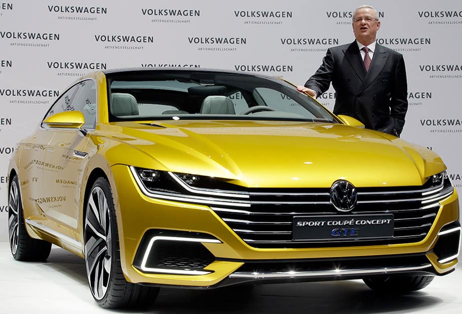 Volkswagen CEO Martin Winterkorn poses for the media beside a GET concept car prior to the company's annual press conference in Berlin, Germany.