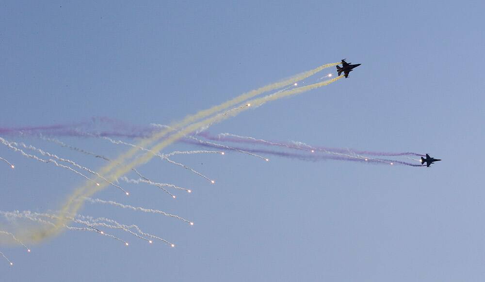 South Korean Air Force RF-16 fighters fire flare shells during the joint commission ceremony of 6,478 new military officers of the army, navy, air force and marines at the military headquarters in Gyeryong, south of Seoul, South Korea.