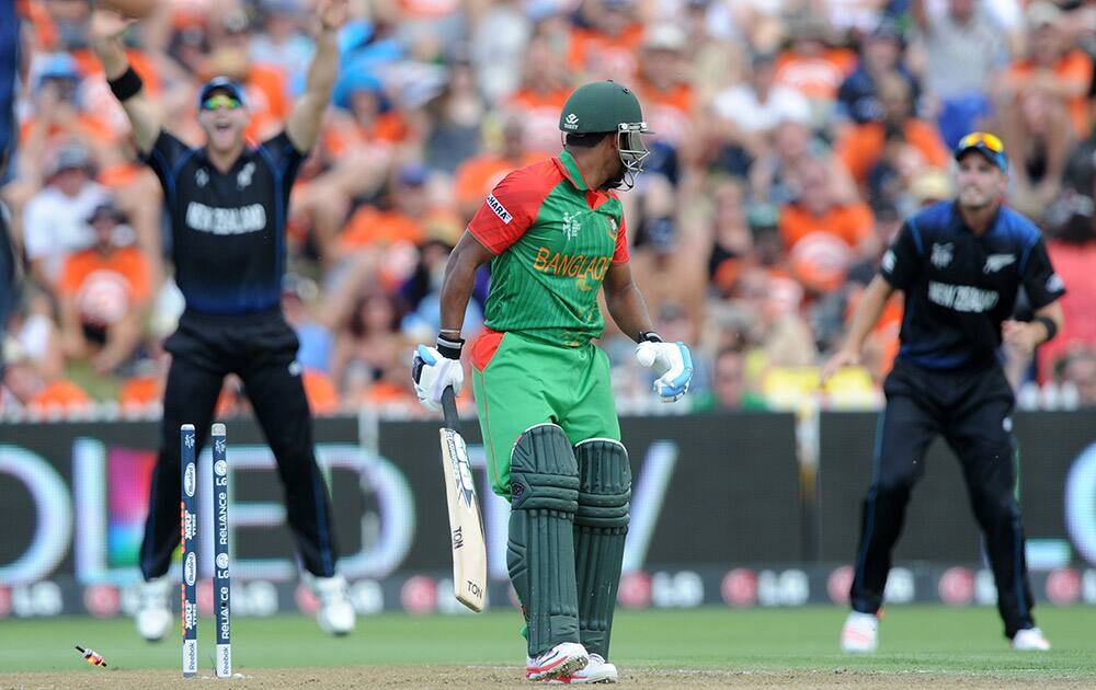 Bangladesh's Imrul Kayes looks around to see that he is bowled for two runs during their Cricket World Cup Pool A match against New Zealand in Hamilton, New Zealand.