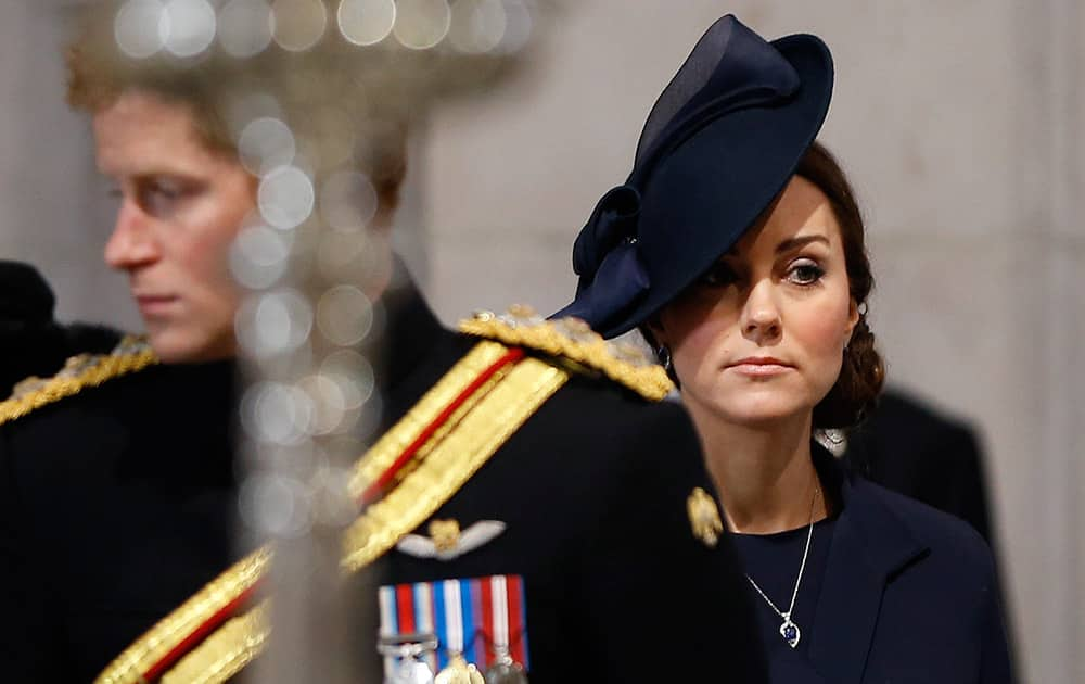 Britain's Kate, the Duchess of Cambridge stands near Prince Harry as they arrive to attend the Service of Commemoration – Afghanistan, at St Paul's Cathedral in London.