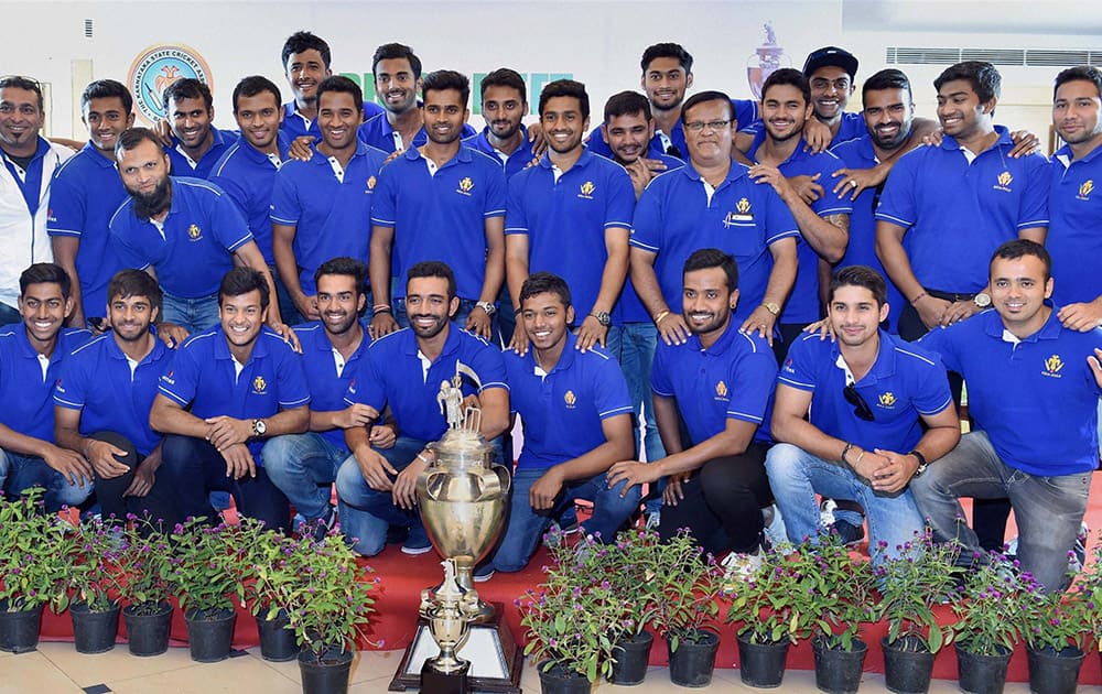 Ranji Trophy winner Karnataka team players pose for a photo during a felicitation event at KSCA in Bengaluru.