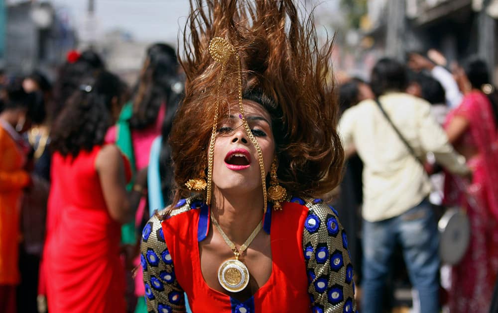 A eunuch dances during a rally to mark the congregation of thousands of eunuchs from different parts of India, in Jammu.