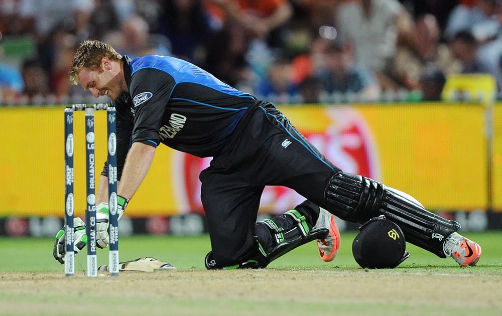 New Zealand’s Martin Guptill reacts as he suffers cramps while batting against Bangladesh during their Cricket World Cup Pool A match in Hamilton, New Zealand.