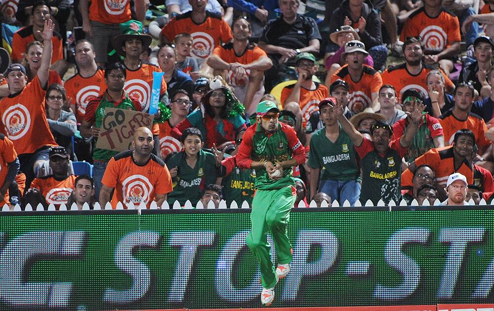 Bangladesh’s Nasir Hossain takes a catch to dismiss New Zealand batsman Luke Ronchi during their Cricket World Cup Pool A match in Hamilton, New Zealand.