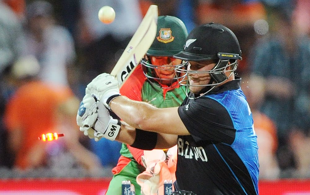 New Zealand’s Corey Anderson is bowled out for 39 runs as Bangladesh wicketkeeper Mushfiqur Rahim watches during their Cricket World Cup Pool A match in Hamilton, New Zealand.