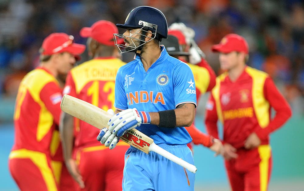 Virat Kohlin walks from the field after he was dismissed for 38 runs while batting against Zimbabwe during their Cricket World Cup Pool B match in Auckland, New Zealand.