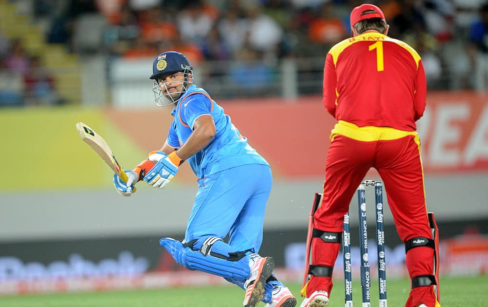 Suresh Raina plays a shot behind Zimbabwe wicketkeeper Brendon Taylor, during their Cricket World Cup Pool B match in Auckland, New Zealand.