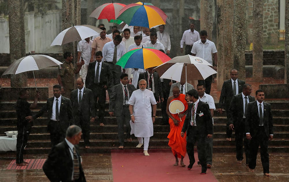 Prime Minister Narendra Modi arrives at Ruwanwelisaya, a sacred stupa in Anuradhapura, about 230 kilometers northeast of Colombo, Sri Lanka.