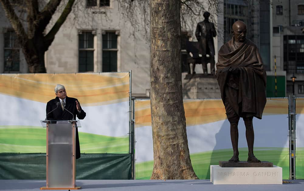 Gandhi's grandson Gopalkrishna Gandhi makes a speech next to a new statue of Mahatma Gandhi by British sculptor Philip Jackson after it was unveiled in Parliament Square, London.
