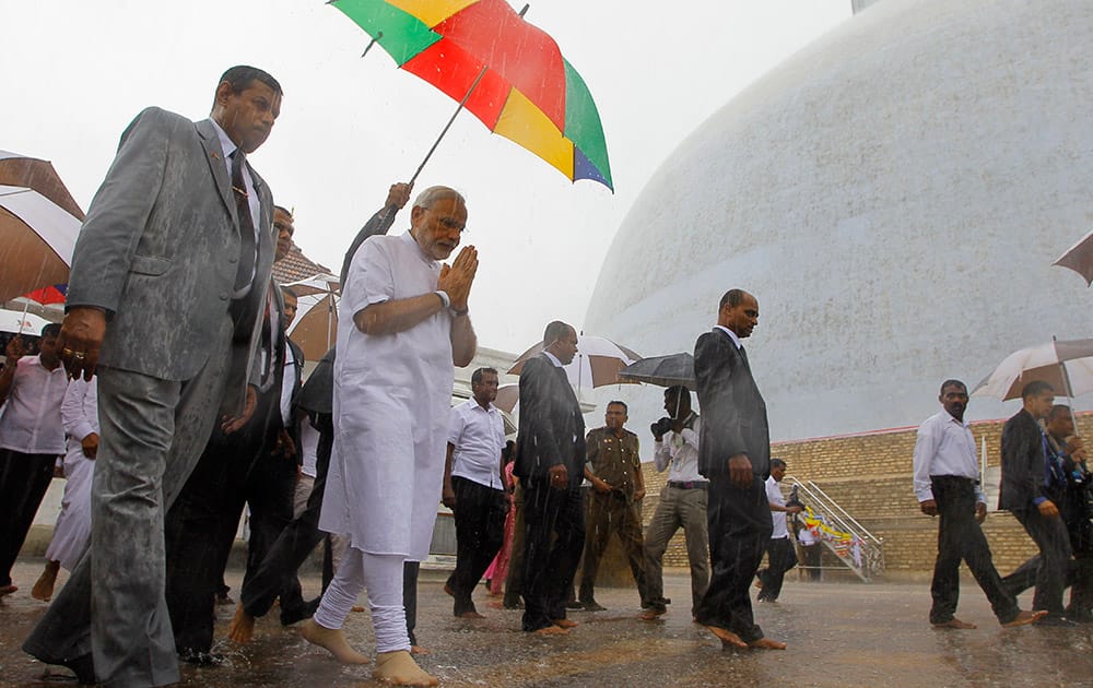 Prime Minister Narendra Modi folds his hands in a sign of respect during his visit to Ruwanwelisaya, a sacred stupa in Anuradhapura, about 230 kilometers northeast of Colombo, Sri Lanka.