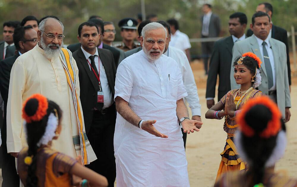 Prime Minister Narendra Modi arrives for the handing over of homes under a housing scheme funded by the Indian government for war victims in Llavalai, northwest of Jaffna, Sri Lanka.