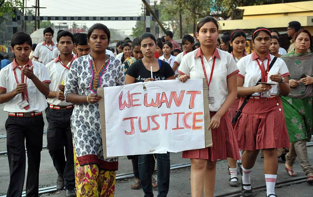 Students of Convent of Jesus and Mary School participate in a protest against the gang rape of a nun in her 70s by a group of bandits when she tried to prevent them from robbing the Christian missionary school in Begopara, about 80 kilometers (50 miles) northeast of Kolkata.