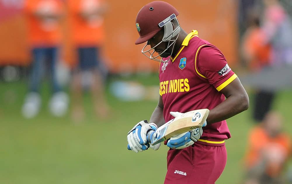 West Indies batsman Andre Russell walks from the field after he was dismissed seven runs during their Cricket World Cup Pool B match in Napier, New Zealand.