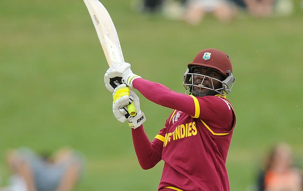 West Indies batsman Jonathan Carter hits the ball while batting against the United Arab Emirates during their Cricket World Cup Pool B match in Napier, New Zealand.