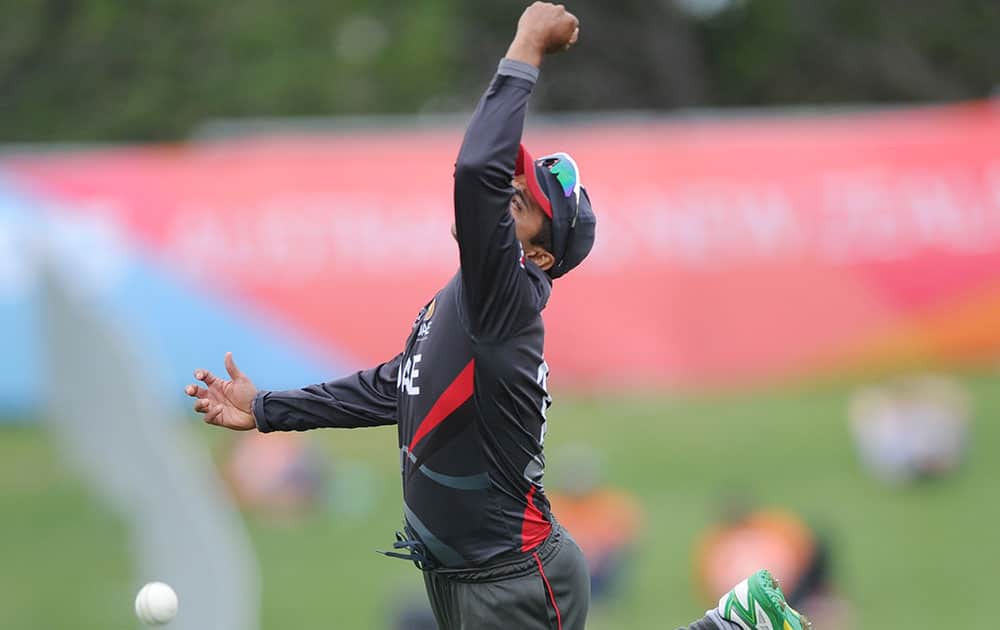 United Arab Emirates Khurram Khan attempts to take a catch during their Cricket World Cup Pool B match against the West Indies in Napier, New Zealand.